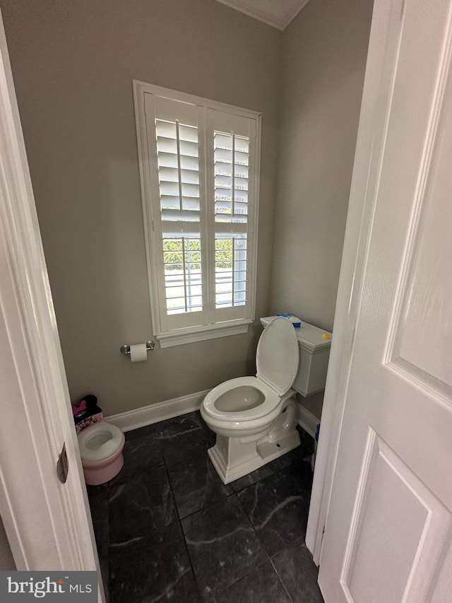 265 N Cologne Ave, Egg Harbor City, NJ 08215 - bathroom with toilet, baseboards, and crown molding
