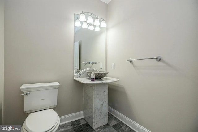 265 N Cologne Ave, Egg Harbor City, NJ 08215 - bathroom with marble look tiles, baseboards, and toilet