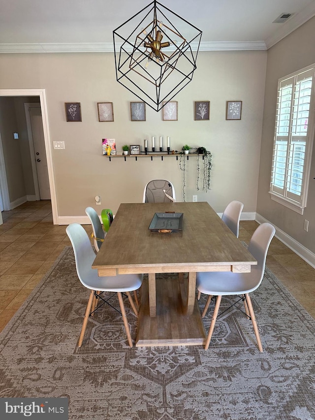 265 N Cologne Ave, Egg Harbor City, NJ 08215 - dining area featuring baseboards, crown molding, a chandelier, and tile patterned floors
