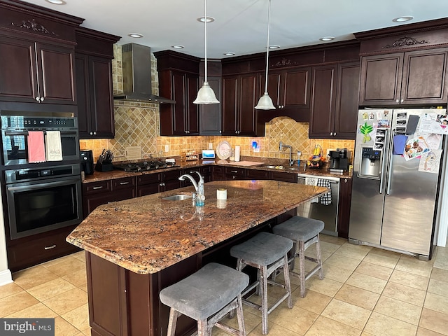 265 N Cologne Ave, Egg Harbor City, NJ 08215 - kitchen featuring appliances with stainless steel finishes, wall chimney range hood, a sink, backsplash, and recessed lighting