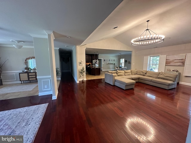 265 N Cologne Ave, Egg Harbor City, NJ 08215 - living area featuring a chandelier, wood finished floors, ornamental molding, vaulted ceiling, and wainscoting