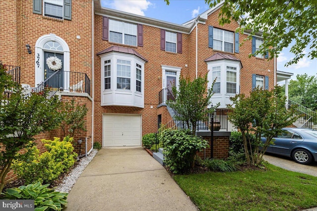 3765 Glebe Meadow Way, Edgewater, MD 21037 - multi unit property with an attached garage, concrete driveway, and brick siding