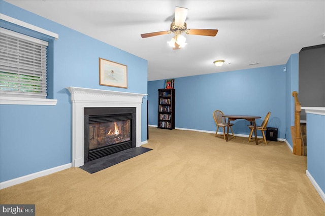 3765 Glebe Meadow Way, Edgewater, MD 21037 - living area featuring carpet flooring, a fireplace with flush hearth, baseboards, and a ceiling fan