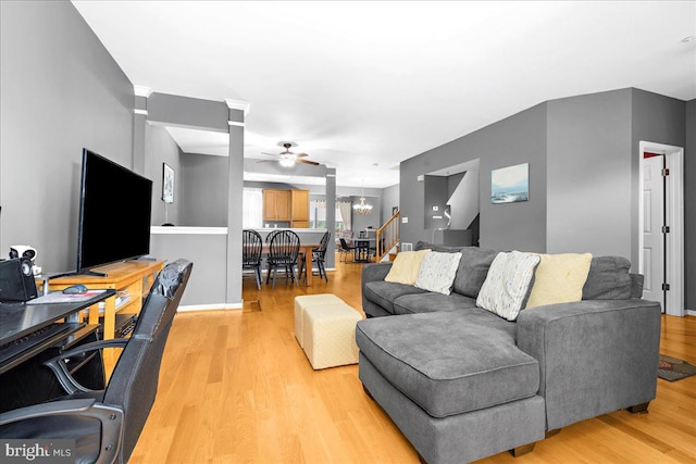 3765 Glebe Meadow Way, Edgewater, MD 21037 - living area featuring light wood-type flooring, ceiling fan, a chandelier, and baseboards