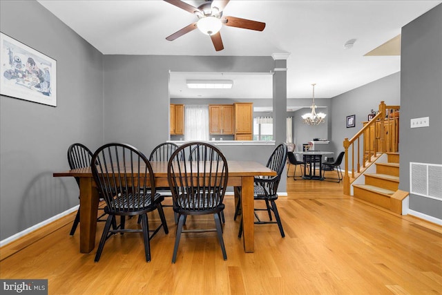 3765 Glebe Meadow Way, Edgewater, MD 21037 - dining area with light wood-type flooring, a chandelier, a ceiling fan, baseboards, and stairway