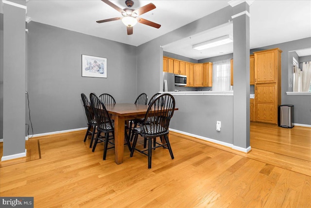 3765 Glebe Meadow Way, Edgewater, MD 21037 - dining room featuring a ceiling fan, decorative columns, baseboards, and light wood finished floors
