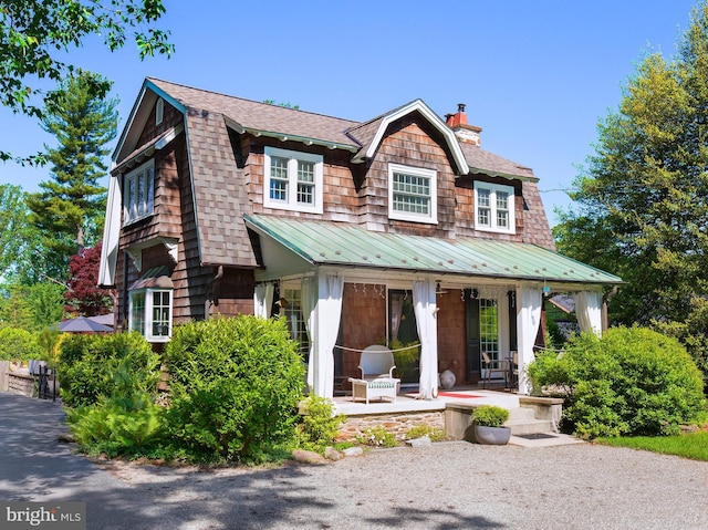 442 Old Eagle School Rd, Wayne, PA 19087 - shingle-style home featuring a gambrel roof, a standing seam roof, metal roof, a chimney, and roof with shingles