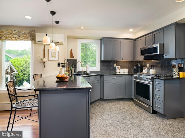 442 Old Eagle School Rd, Wayne, PA 19087 - kitchen with appliances with stainless steel finishes, a sink, a wall mounted AC, gray cabinetry, and recessed lighting