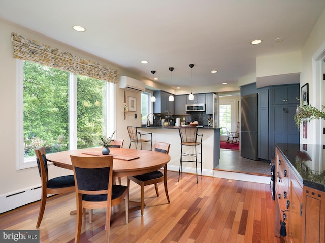 442 Old Eagle School Rd, Wayne, PA 19087 - dining space with a wall mounted air conditioner, recessed lighting, light wood-style flooring, and a baseboard radiator