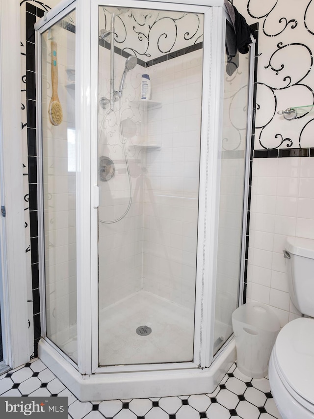 442 Old Eagle School Rd, Wayne, PA 19087 - full bathroom featuring toilet, tile patterned floors, a shower stall, and tile walls