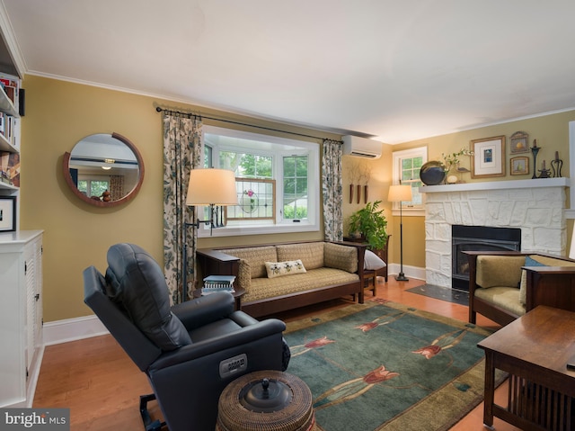 442 Old Eagle School Rd, Wayne, PA 19087 - living area with a fireplace, a wall mounted AC, wood finished floors, baseboards, and crown molding