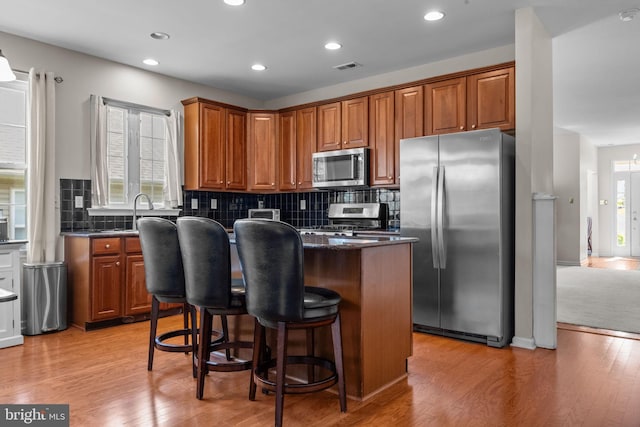 22 Goldfields Ave, Langhorne, PA 19047 - kitchen featuring stainless steel appliances, a kitchen island, backsplash, light wood-style flooring, and recessed lighting