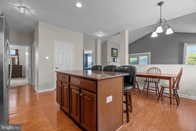 22 Goldfields Ave, Langhorne, PA 19047 - kitchen featuring a breakfast bar, light wood-style flooring, freestanding refrigerator, a center island, and hanging light fixtures
