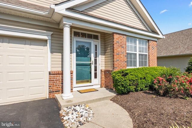 22 Goldfields Ave, Langhorne, PA 19047 - view of exterior entry featuring brick siding and an attached garage