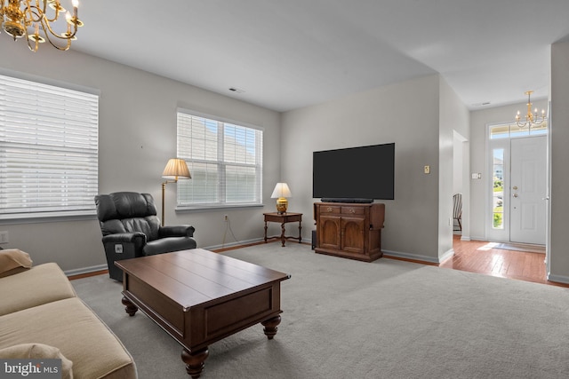 22 Goldfields Ave, Langhorne, PA 19047 - carpeted living area with a chandelier and baseboards