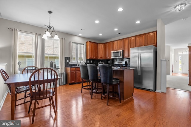 22 Goldfields Ave, Langhorne, PA 19047 - kitchen with stainless steel appliances, a kitchen island, dark countertops, backsplash, and recessed lighting