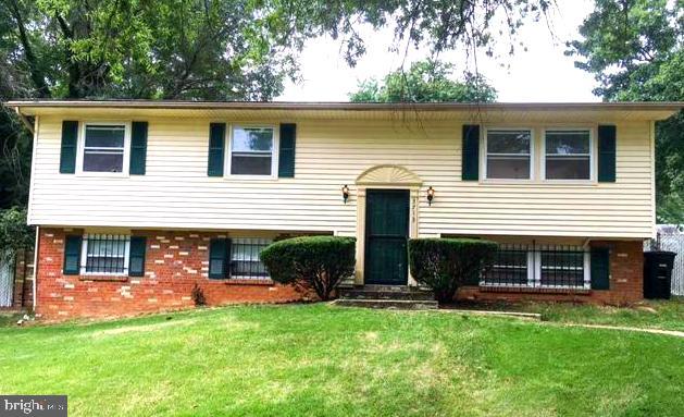 3713 Deming Dr, Suitland, MD 20746 - split foyer home featuring brick siding and a front yard