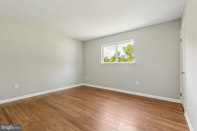 3713 Deming Dr, Suitland, MD 20746 - empty room with wood finished floors and baseboards
