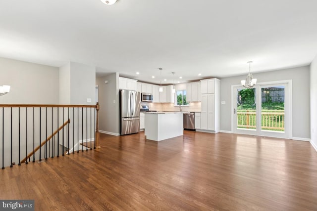 3713 Deming Dr, Suitland, MD 20746 - unfurnished living room featuring a chandelier, dark wood-style flooring, baseboards, recessed lighting, and a sink