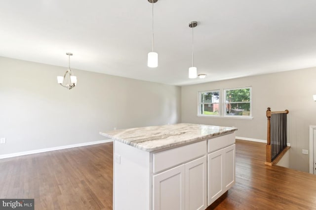 3713 Deming Dr, Suitland, MD 20746 - kitchen featuring dark wood-type flooring, a center island, white cabinets, pendant lighting, and baseboards