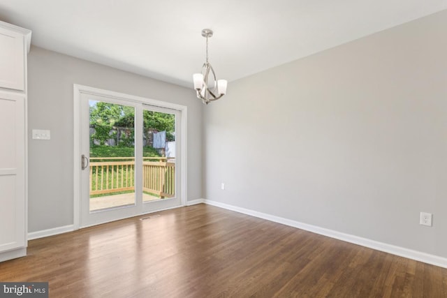 3713 Deming Dr, Suitland, MD 20746 - empty room featuring wood finished floors, a chandelier, and baseboards
