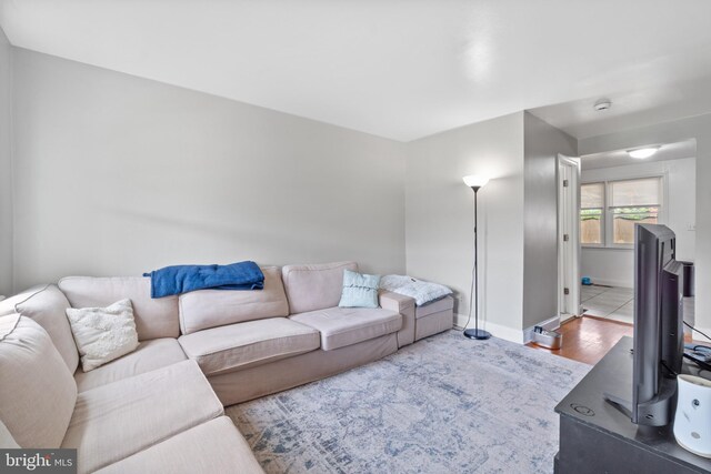 6904 Bank St, Baltimore, MD 21224 - living room with baseboards and wood finished floors