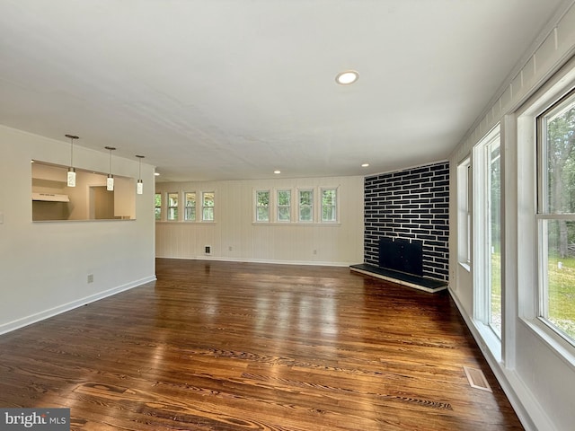 1511 N Ave, Port Norris, NJ 08349 - unfurnished living room featuring dark wood-style flooring, a fireplace, baseboards, and recessed lighting