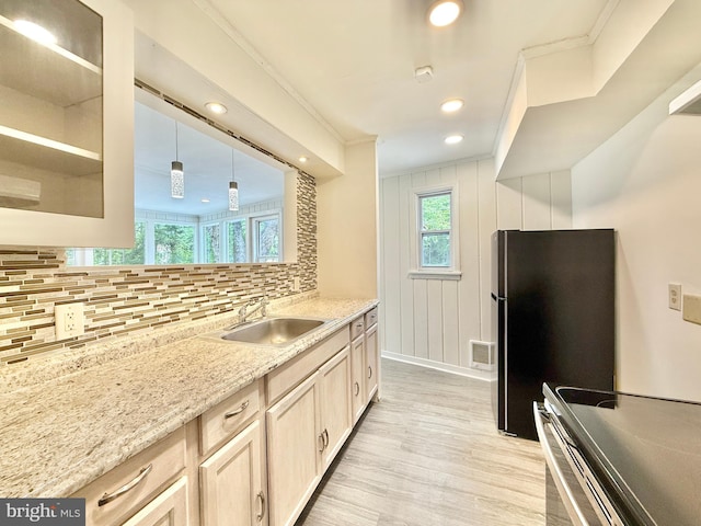 1511 N Ave, Port Norris, NJ 08349 - kitchen with a sink, range with electric cooktop, tasteful backsplash, light wood finished floors, and freestanding refrigerator