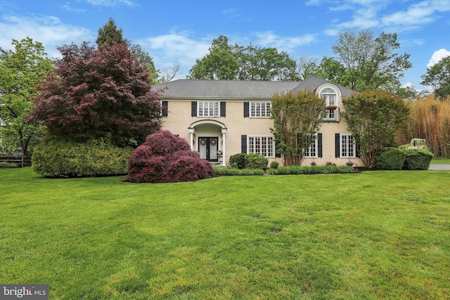 609 Ederer Ln, Ambler, PA 19002 - georgian-style home featuring a front yard and stucco siding