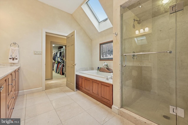 609 Ederer Ln, Ambler, PA 19002 - full bath featuring a skylight, a garden tub, tile patterned flooring, a stall shower, and vanity