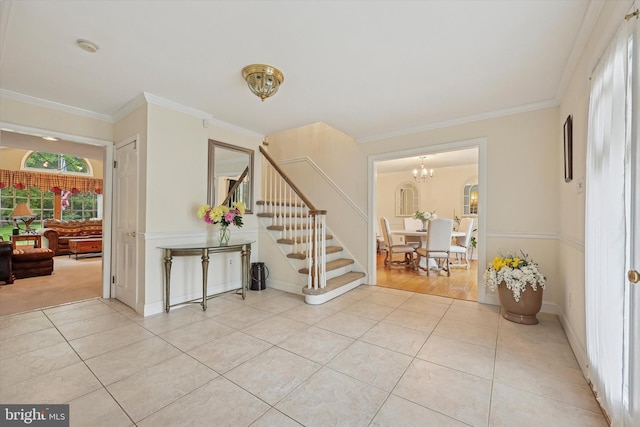 609 Ederer Ln, Ambler, PA 19002 - entrance foyer with stairway, light tile patterned floors, a chandelier, and ornamental molding