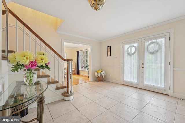 609 Ederer Ln, Ambler, PA 19002 - entrance foyer with stairs, light tile patterned flooring, french doors, ornamental molding, and baseboards