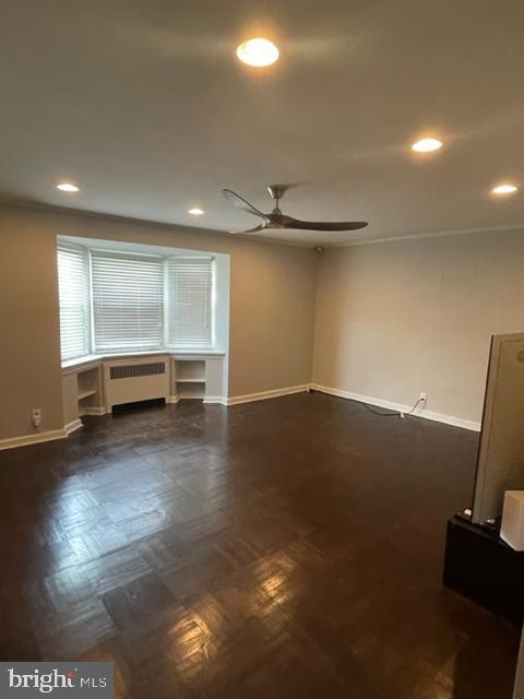2632 Lenape Rd, Philadelphia, PA 19131 - unfurnished living room featuring baseboards, ceiling fan, recessed lighting, and radiator