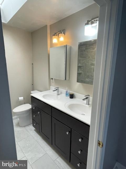 2632 Lenape Rd, Philadelphia, PA 19131 - bathroom with double vanity and toilet