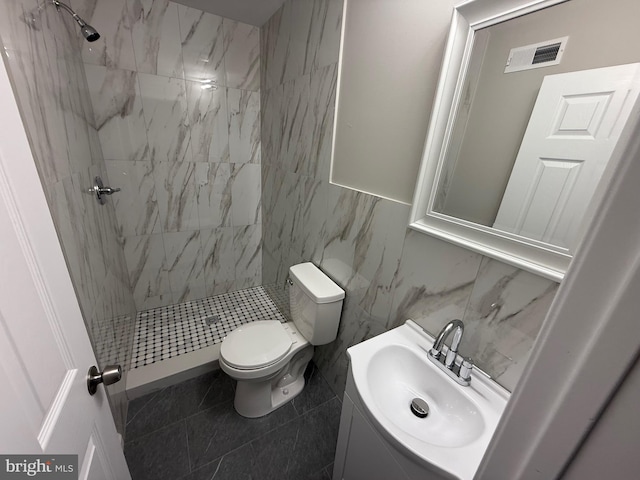 2127 Melvin St, Philadelphia, PA 19131 - bathroom with vanity, a stall shower, toilet, tile walls, and tile patterned flooring