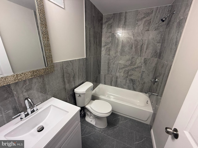 2127 Melvin St, Philadelphia, PA 19131 - full bathroom with toilet, shower / tub combination, vanity, and tile walls