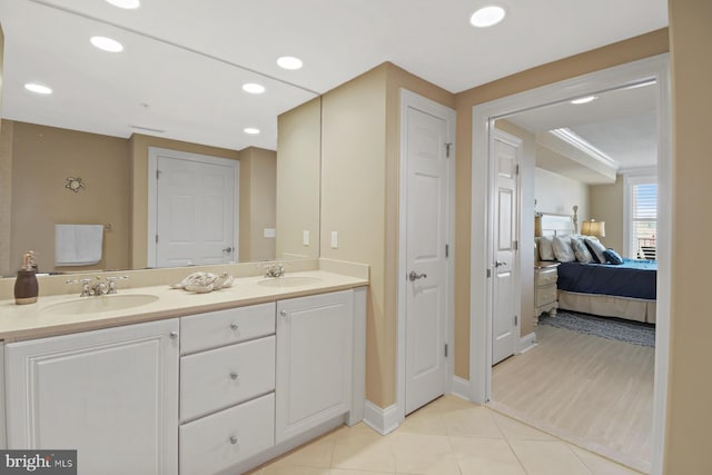 6 7th St Unit 508, Ocean City, MD 21842 - ensuite bathroom featuring double vanity, tile patterned flooring, recessed lighting, and baseboards