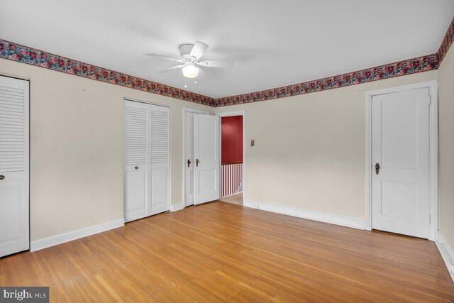 3440 Sheffield Ave, Philadelphia, PA 19136 - unfurnished bedroom featuring baseboards, light wood-style floors, two closets, and a ceiling fan