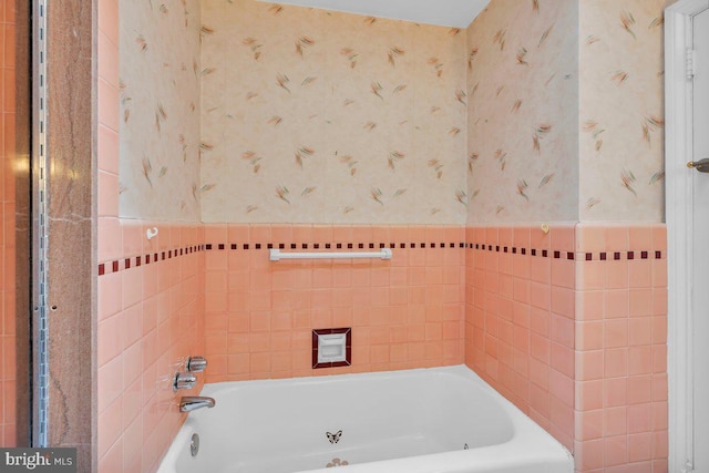 3440 Sheffield Ave, Philadelphia, PA 19136 - bathroom featuring wallpapered walls, a bath, a wainscoted wall, and tile walls