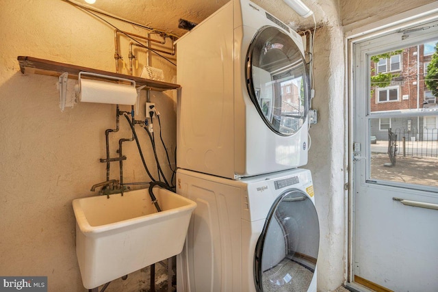 3440 Sheffield Ave, Philadelphia, PA 19136 - washroom featuring stacked washer and clothes dryer and a textured wall