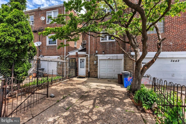 3440 Sheffield Ave, Philadelphia, PA 19136 - view of front of property with driveway, brick siding, and a garage