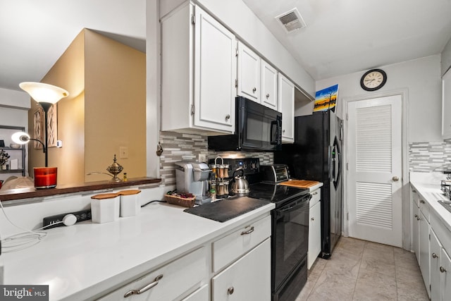 5907L Noblestown Rd Unit 72, Springfield, VA 22152 - kitchen featuring black appliances, white cabinets, tasteful backsplash, light countertops, and light marble finish floors