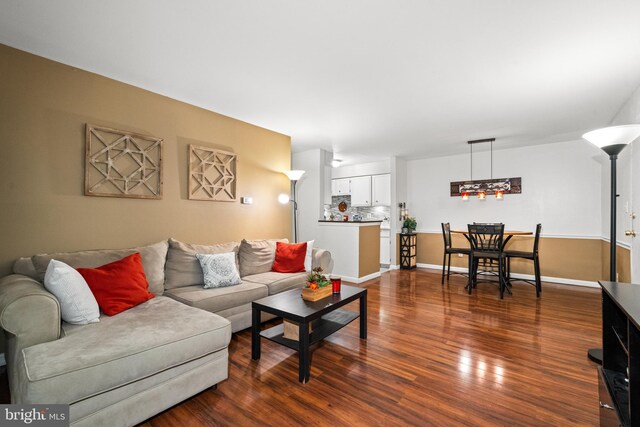 5907L Noblestown Rd Unit 72, Springfield, VA 22152 - living area with dark wood-style floors and baseboards