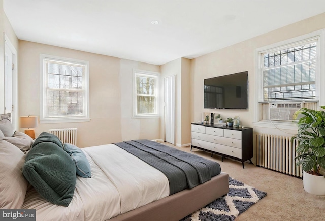 616 Mellon St SE, Washington, DC 20032 - bedroom with radiator heating unit, carpet flooring, and cooling unit