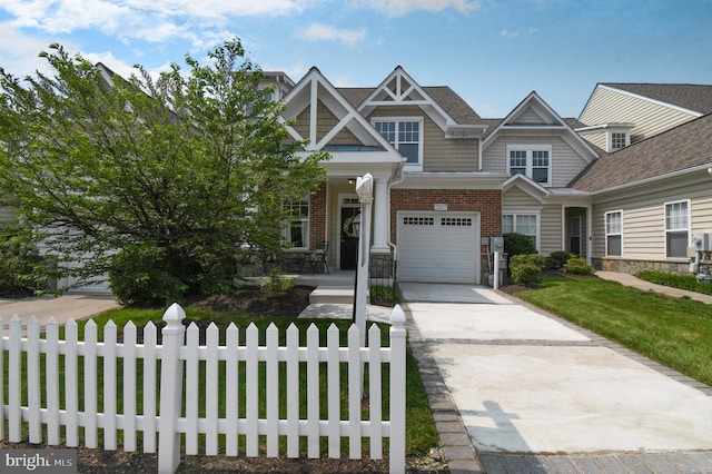 7207 Ivy Bank Rd, Laurel, MD 20707 - view of front facade featuring concrete driveway, an attached garage, brick siding, and stone siding