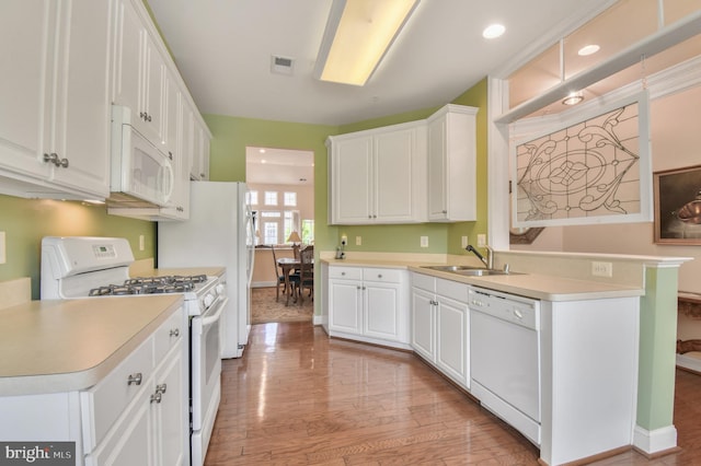7207 Ivy Bank Rd, Laurel, MD 20707 - kitchen with white appliances, a sink, white cabinets, baseboards, and recessed lighting