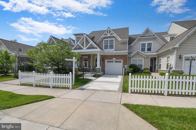 7207 Ivy Bank Rd, Laurel, MD 20707 - view of front facade with concrete driveway, brick siding, a garage, a fenced front yard, and roof with shingles