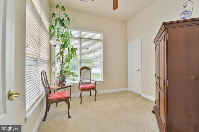 7207 Ivy Bank Rd, Laurel, MD 20707 - living area with plenty of natural light, a ceiling fan, light carpet, and baseboards