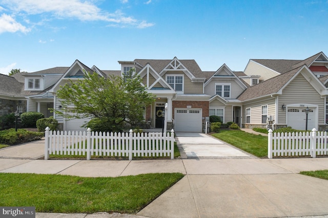 7207 Ivy Bank Rd, Laurel, MD 20707 - view of front facade with driveway, an attached garage, a shingled roof, and stone siding