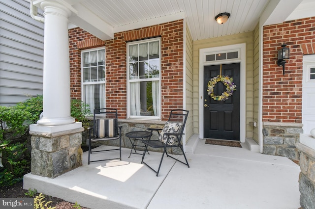 7207 Ivy Bank Rd, Laurel, MD 20707 - property entrance with a porch and brick siding